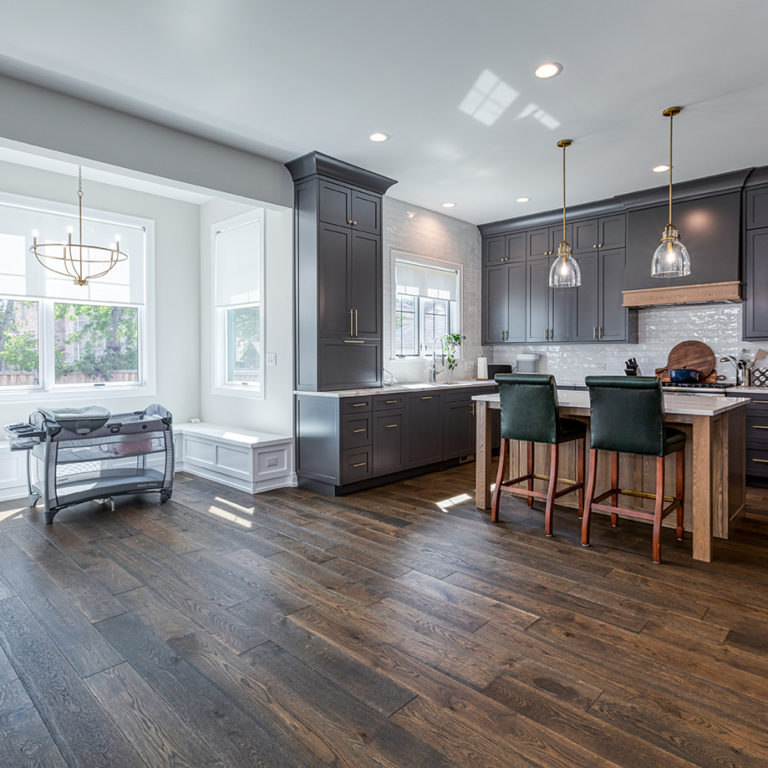 Moody Kitchen Renovations in Elmhurst, Chicago With Black Cabinets And Dark Wood Floors